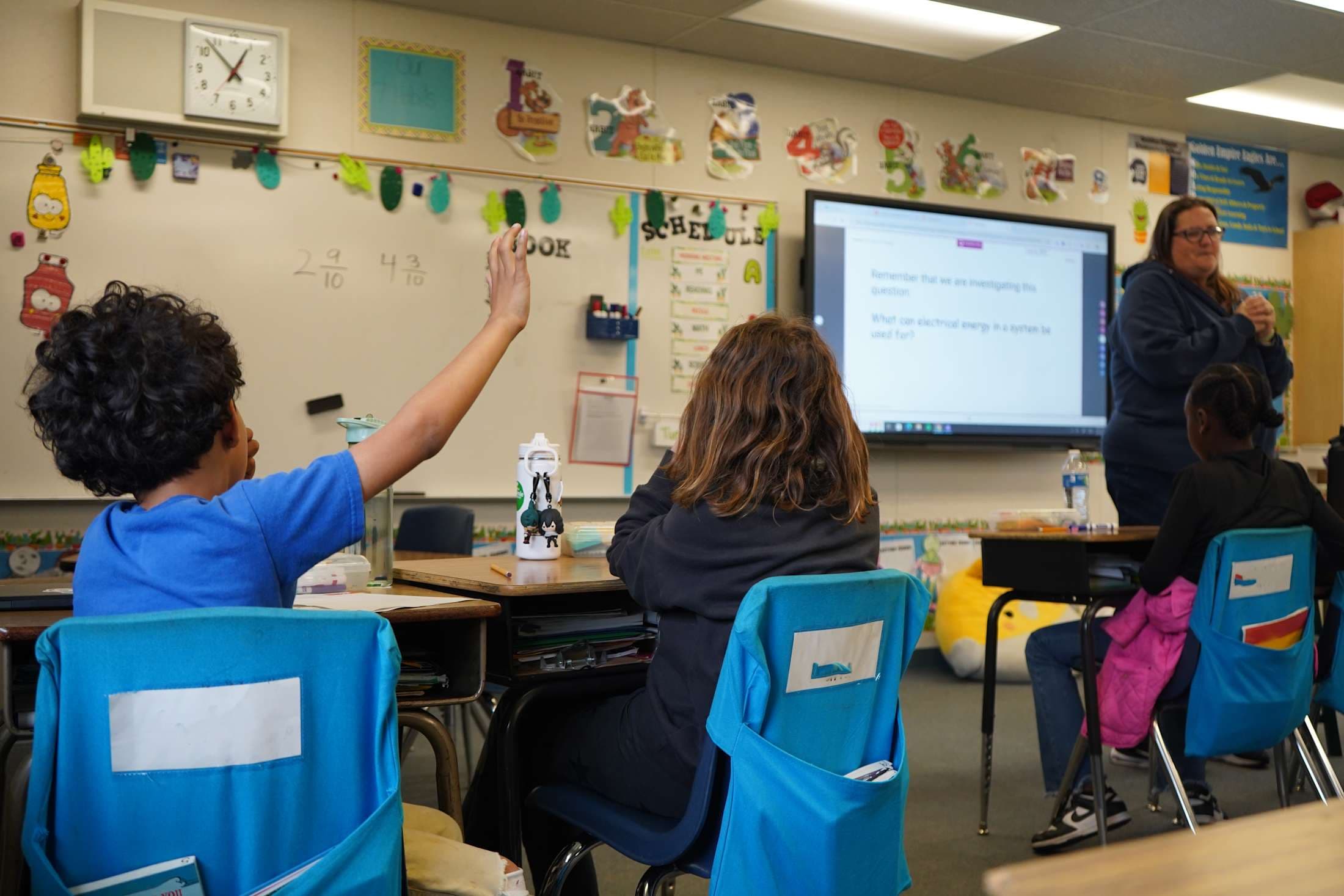 Student Raising Hand in Classroom