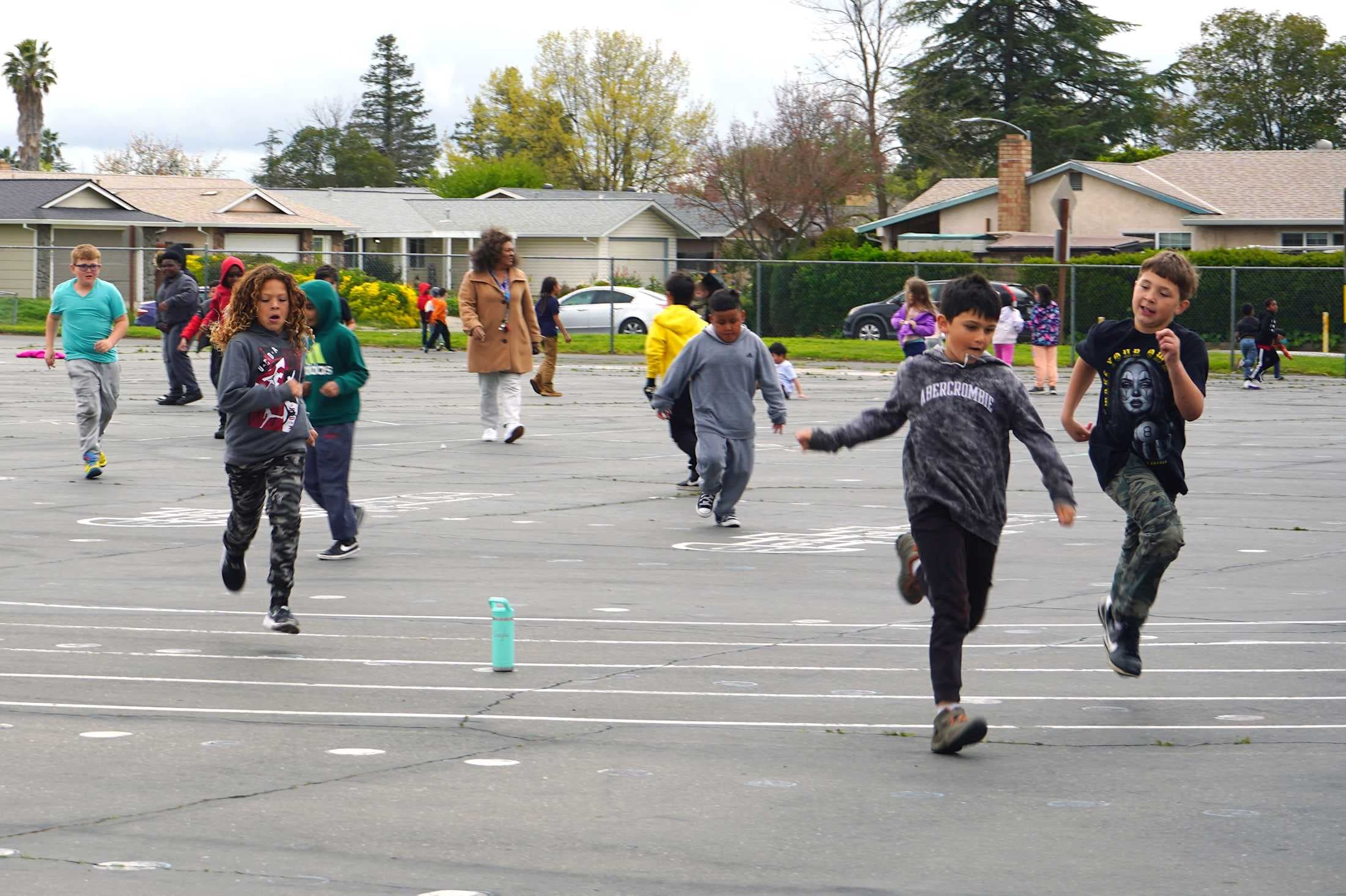 Students running on the blacktop
