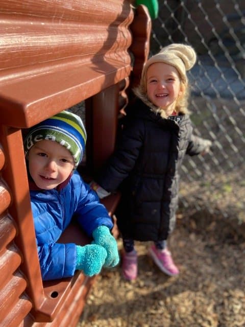 Children outside in the centre's play area.