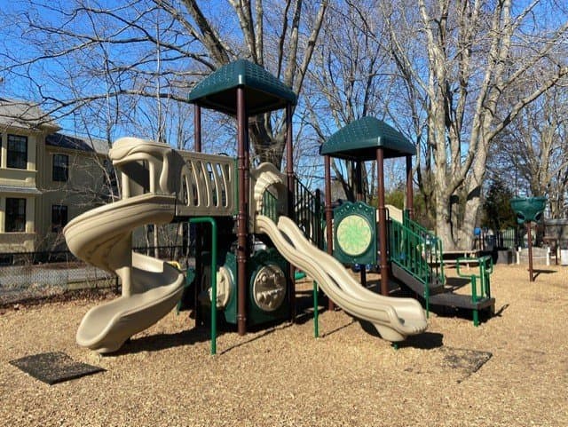 Outdoor play yard with play structures.