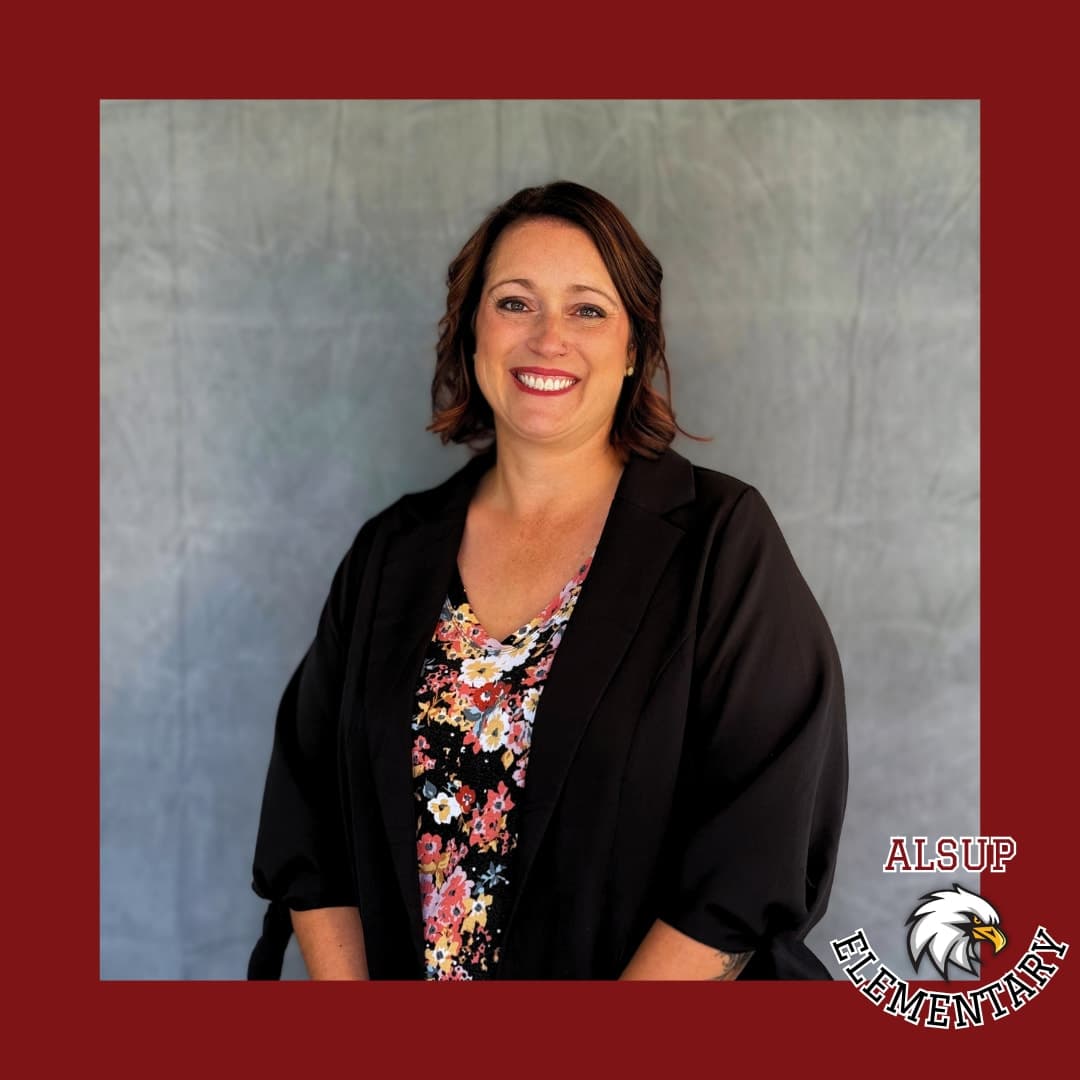 Portrait of the Alsup Elementary principal in professional attire with the school logo.