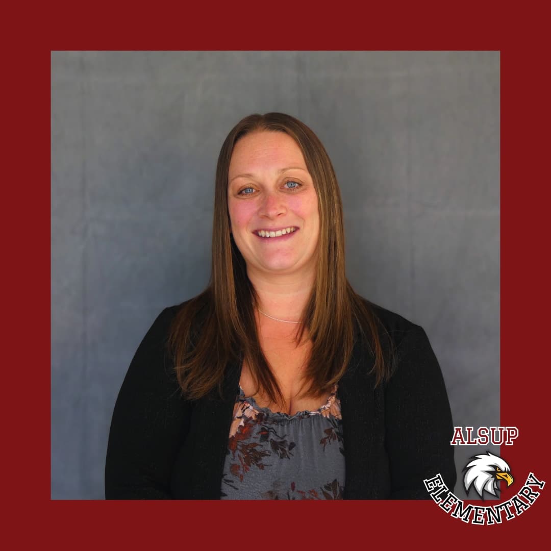 Portrait of an Alsup Elementary assistant principal in professional attire with the school logo.