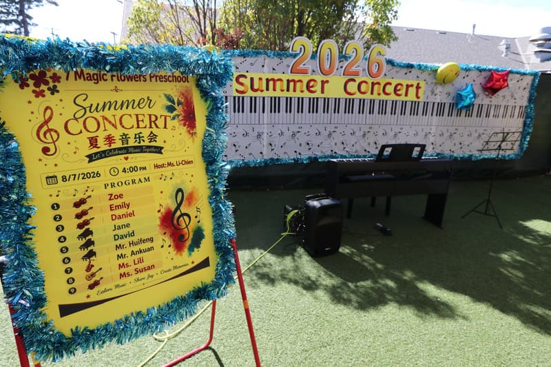 Children and staff at a school event (Summer Concert).