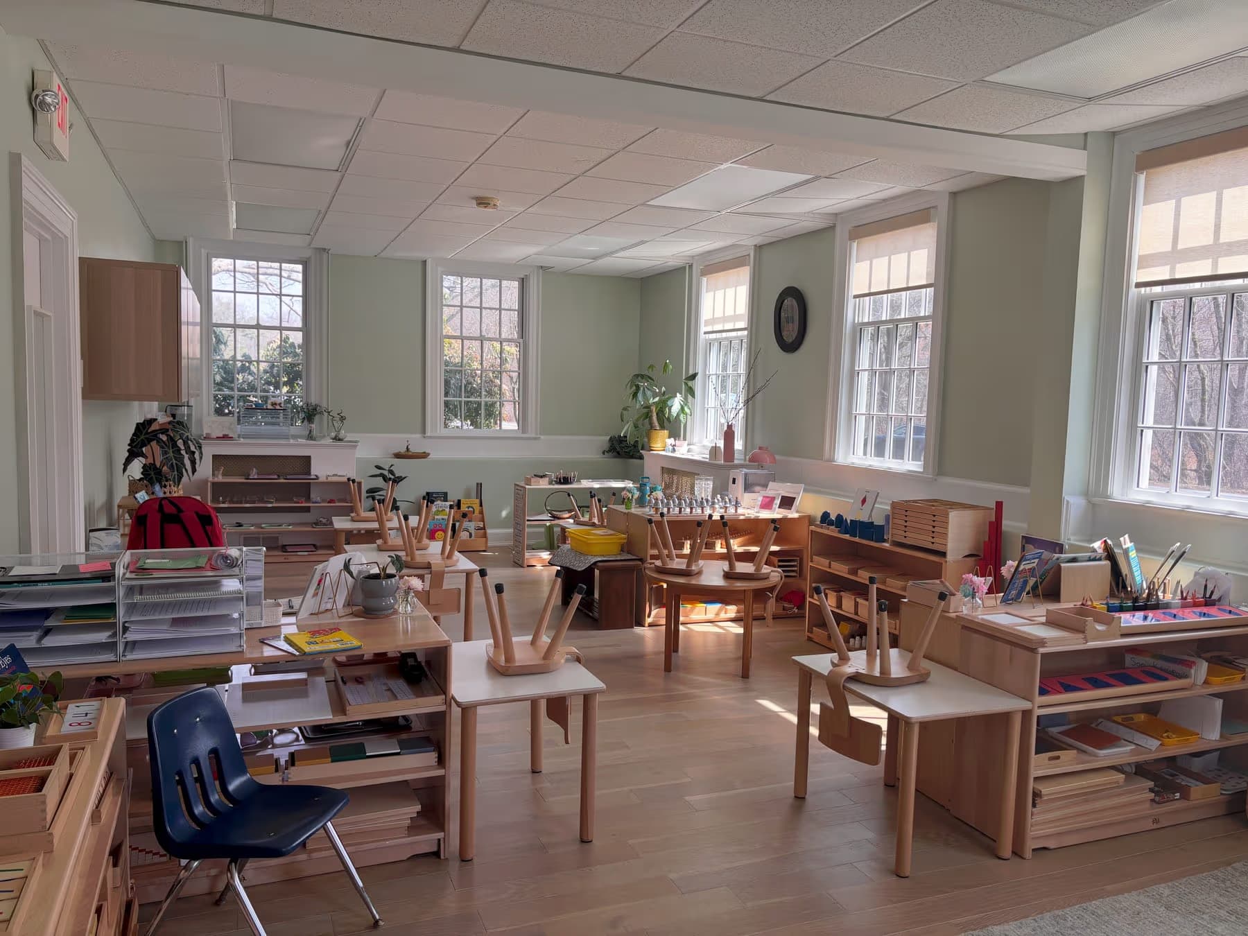 Inside a bright, prepared Montessori classroom at Beacon Montessori School in Weston, MA