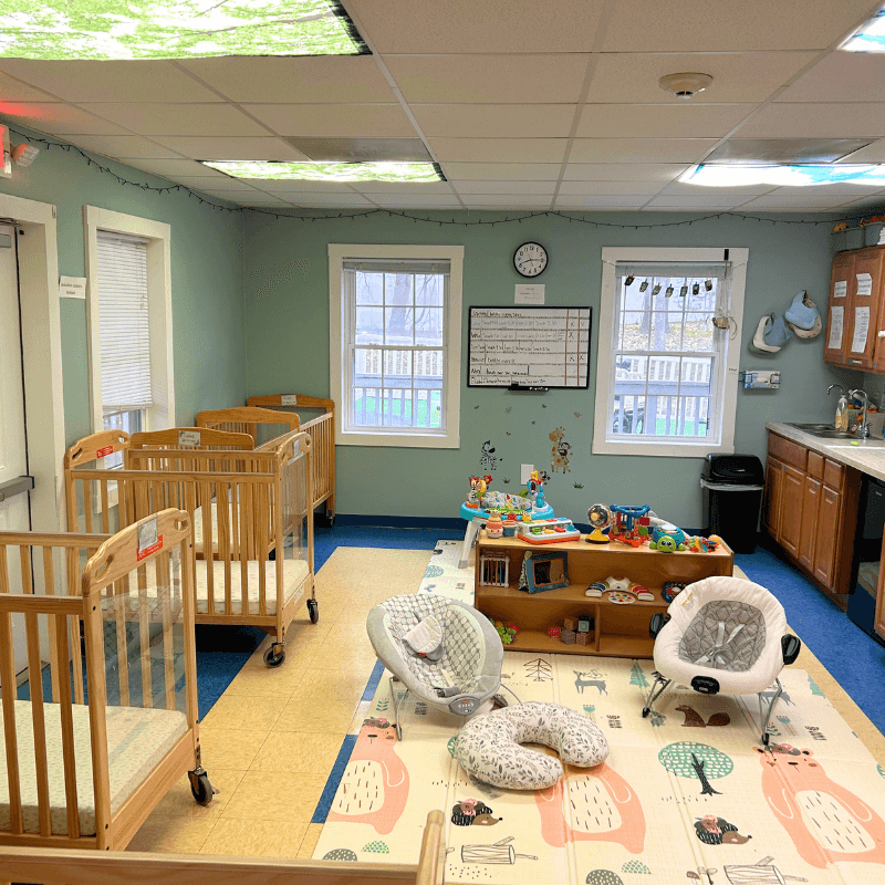 Infant room at Academy Childcare Center. Cribs, Infant Seats and Infant toys