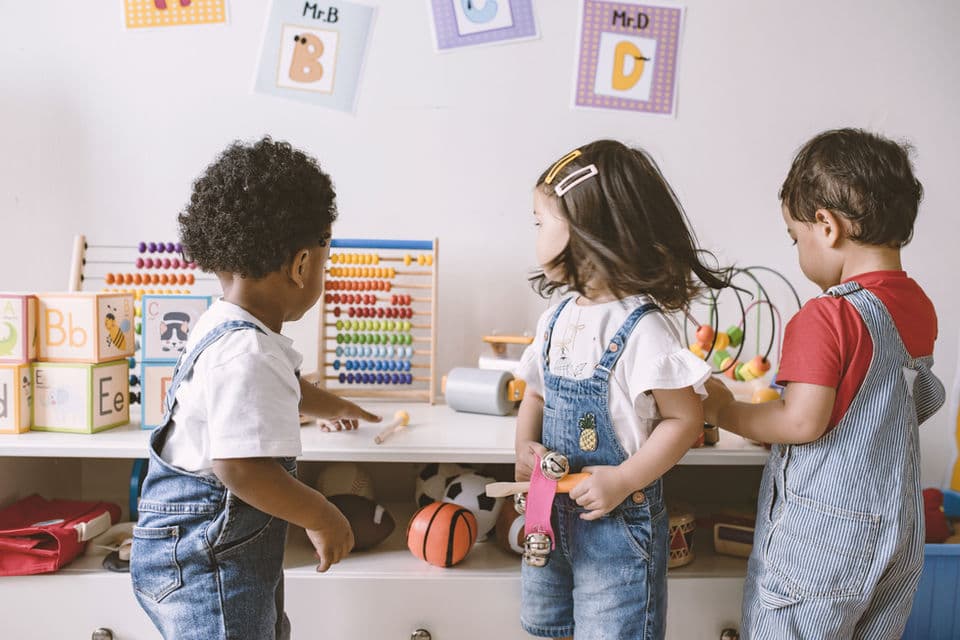 Children and staff in a classroom or activity setting.