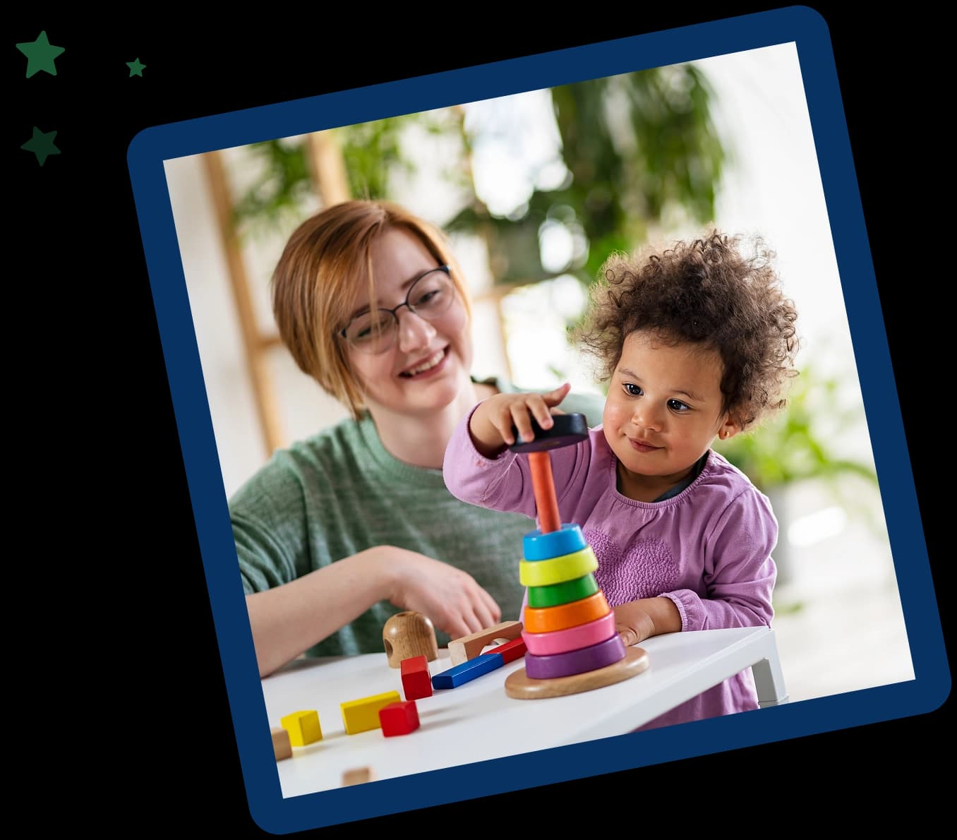 A woman and child playing with toys on the table.
