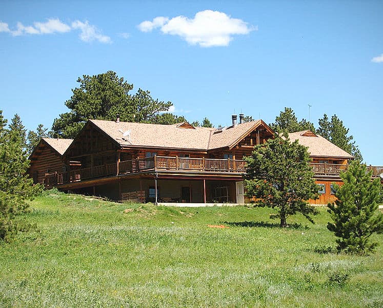 The Calvert Lodge indoor meeting and dining spaces, including a large meeting room and dining hall.